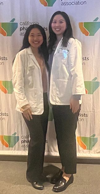 Koay and Kim wearing white coats.